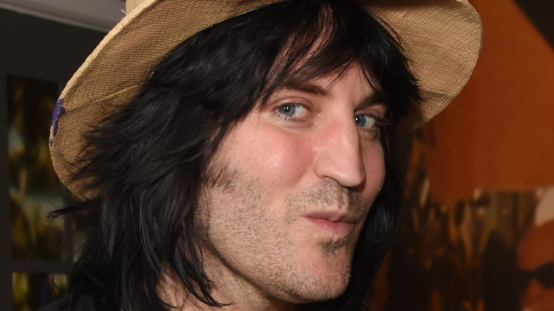 Noel Fielding glancing at the camera
