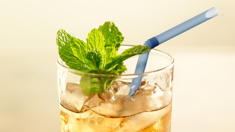 blue bendy straw in iced tea with mint