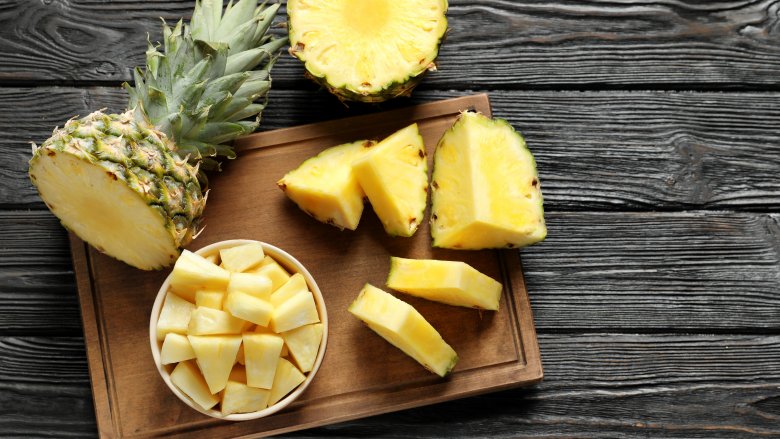 Cut pineapple on cutting board