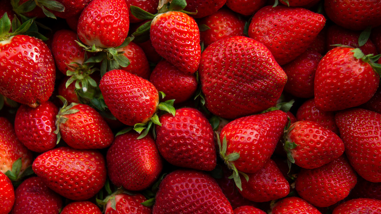 Ripe strawberries in a cluster