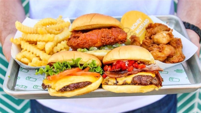 Shake Shack burger, fries, and drink on tray