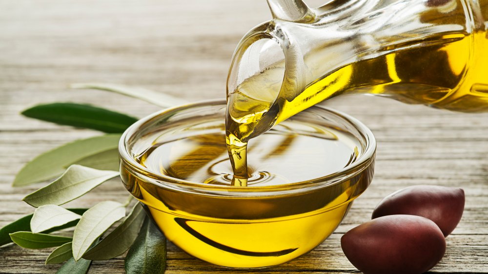 Olive oil being poured into a bowl