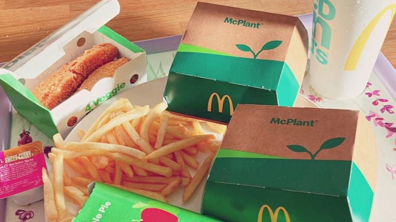Two boxes of the McPlant surrounded by fries and other veggie McDonald's items
