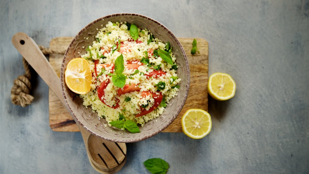 bowl of couscous topped with vegetables