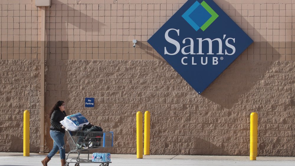 person with cart outside a Sam's Club