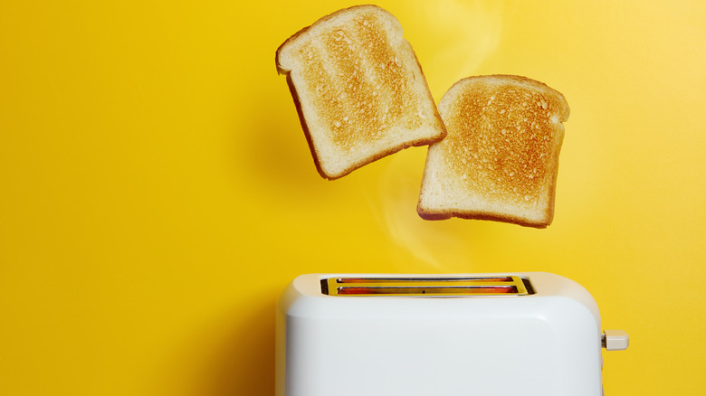 Toast popping out of a toaster