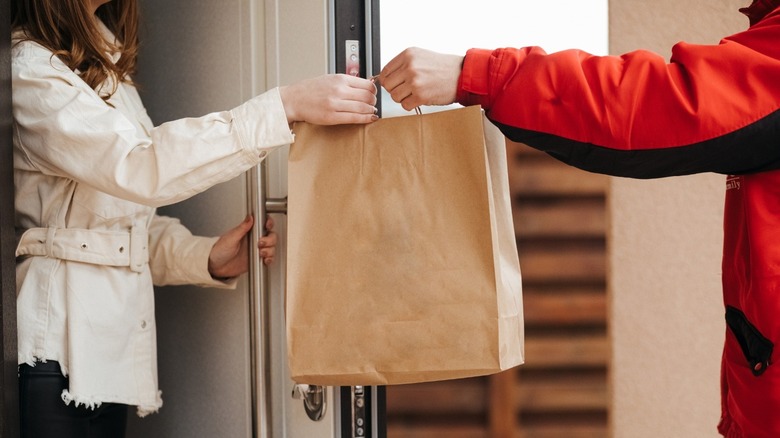 Grubhub delivery person and customer