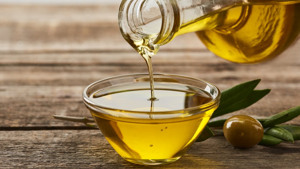 Olive oil poured into a small bowl