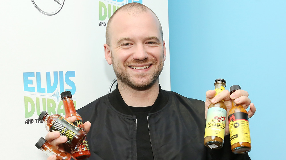 Sean Evans with hot sauce
