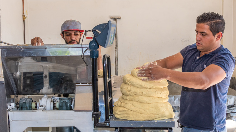 Men working on masa harina