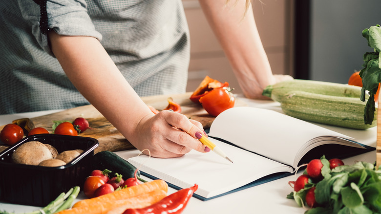 Person reading cookbook