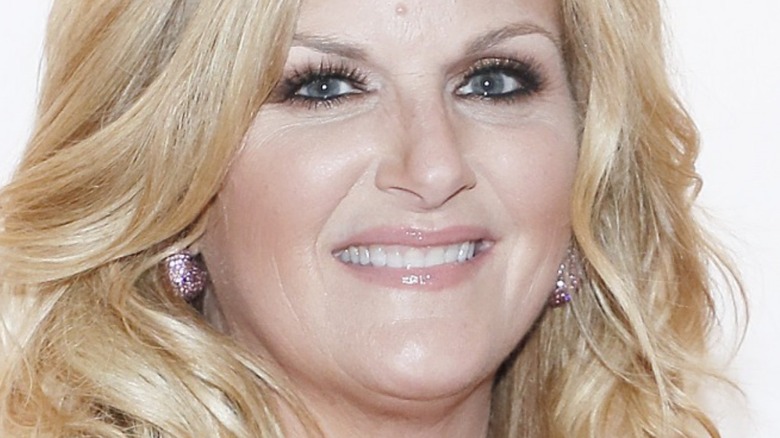 Trisha Yearwood smiling and wearing earrings