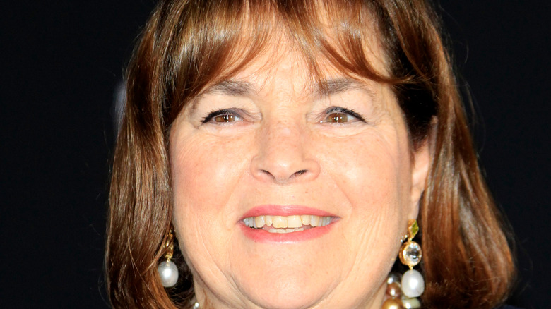 Ina Garten smiles with pearl earrings