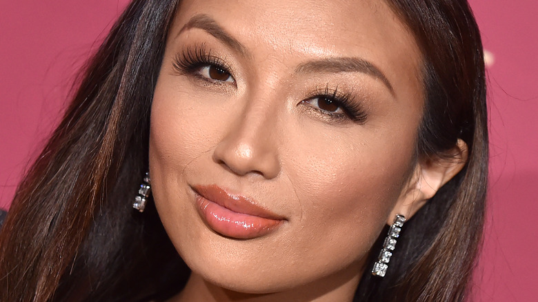 Jeannie Mai posing on the red carpet