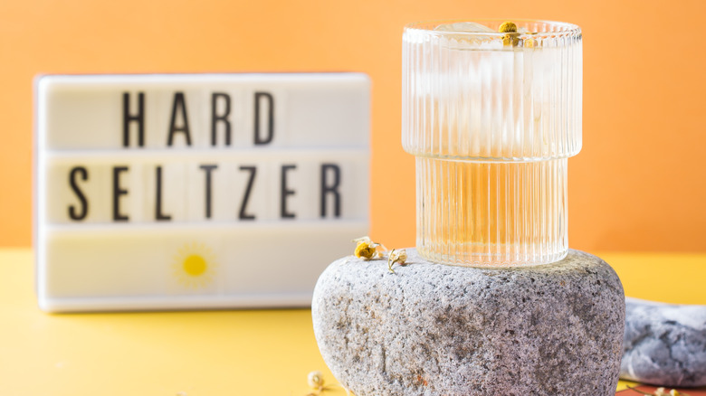Tea-based cocktail in glass atop stone slab