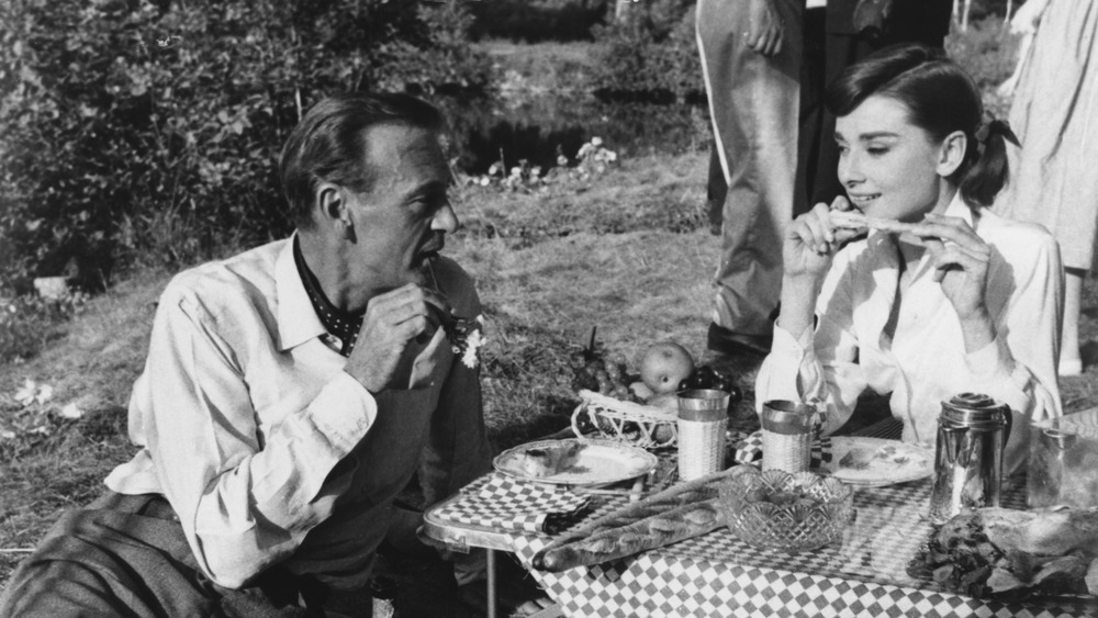 Audrey Hepburn and partner picnic