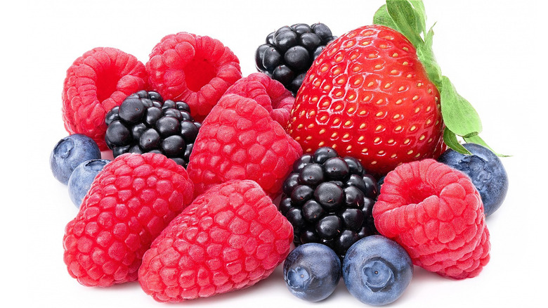 pile of raspberries, blueberries, blackberries and strawberry