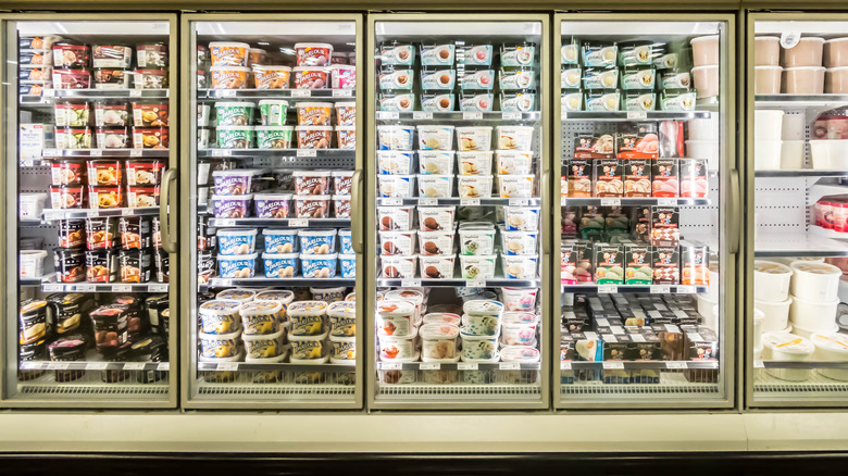 tubs of ice cream in grocery store freezer
