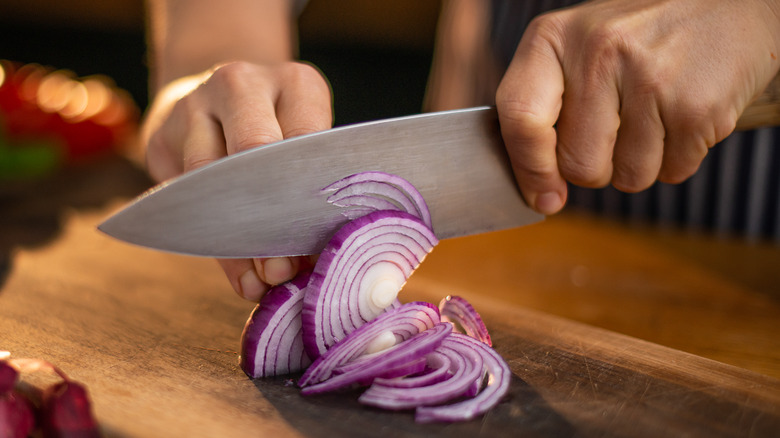 Person cutting onions