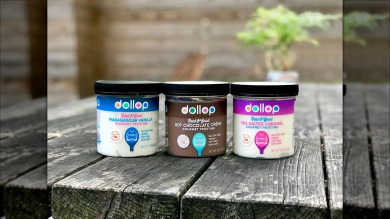 jars of dollop gourmet frosting in three flavors
