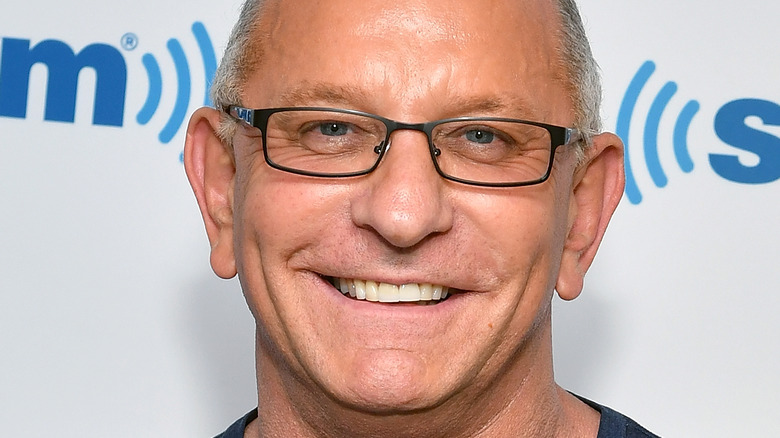 Robert Irvine smiling with glasses