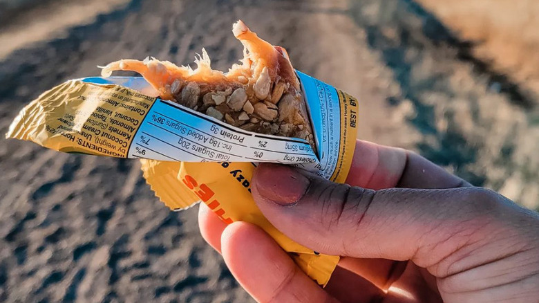 Hand holding a Bon Bee bar