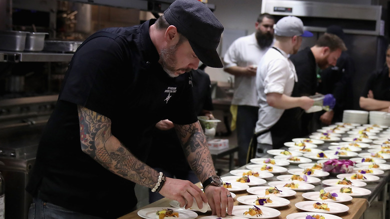 Shaun O'Neale plating a dish