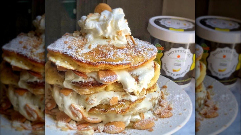A stack of pancakes with cream