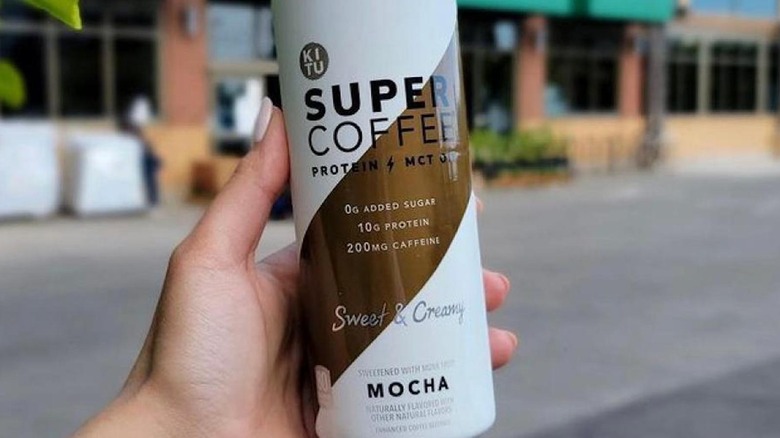 mocha Super Coffee in hand