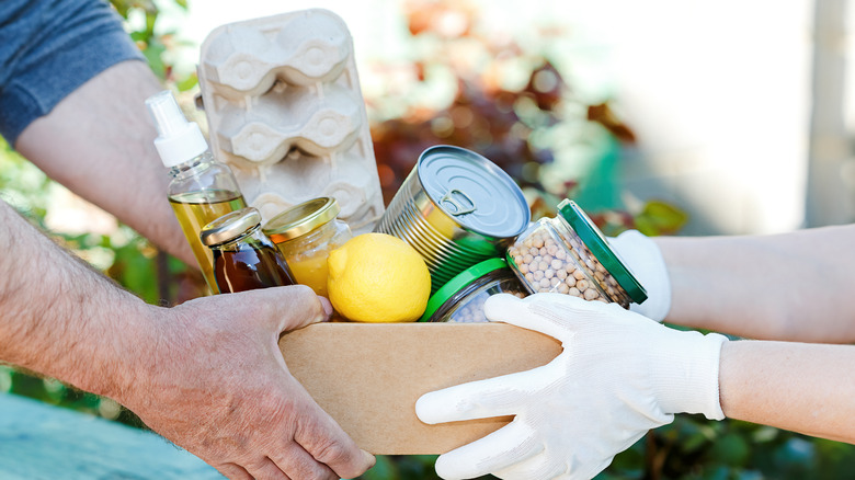 Person donating box of food