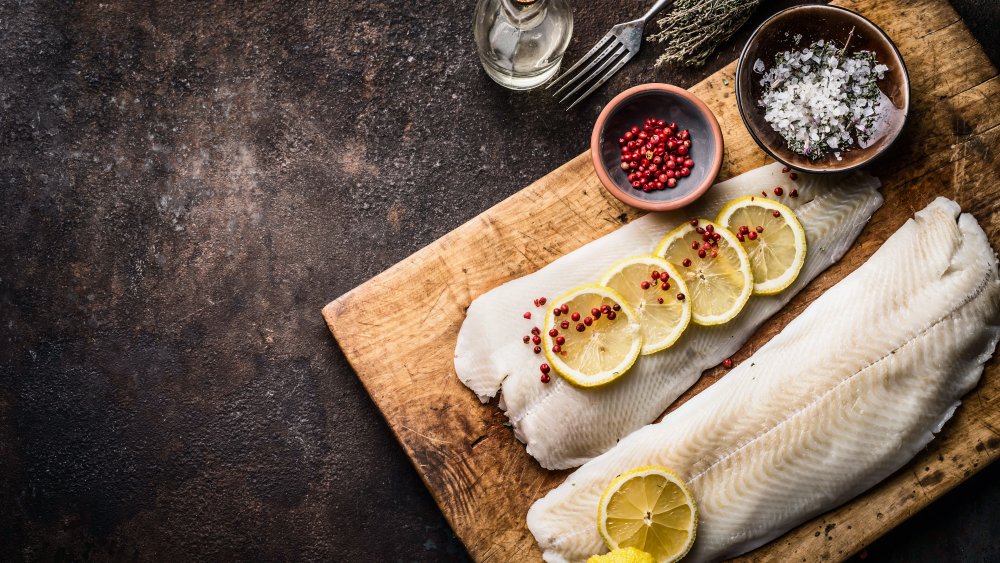 Raw cod filet with seasoning