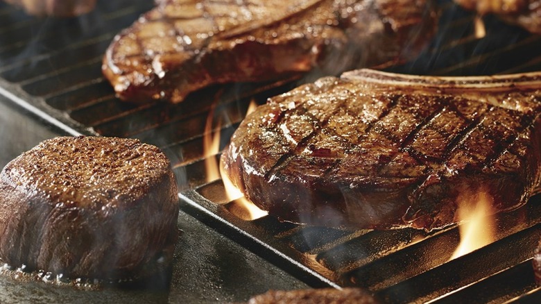 steaks on a grill