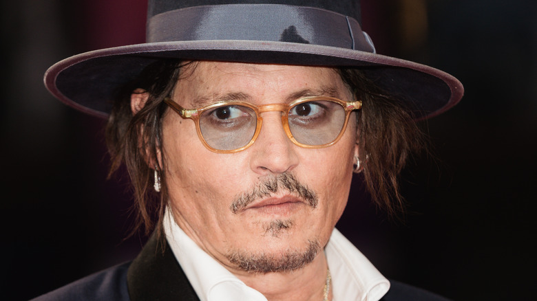 Johnny Depp in hat and glasses