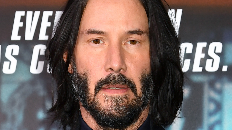 Keanu Reeves with beard and long hair