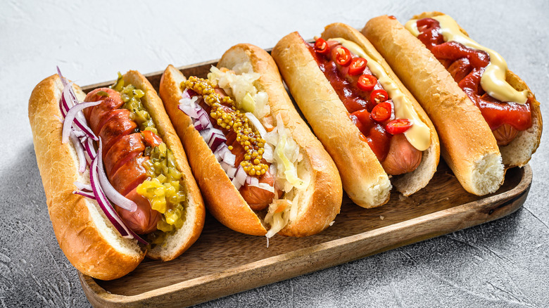 hot dogs with assorted toppings