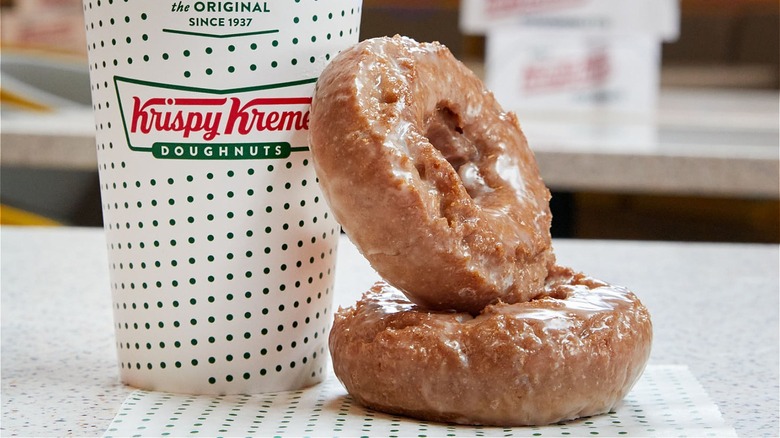 Krispy Kreme donuts beside coffee