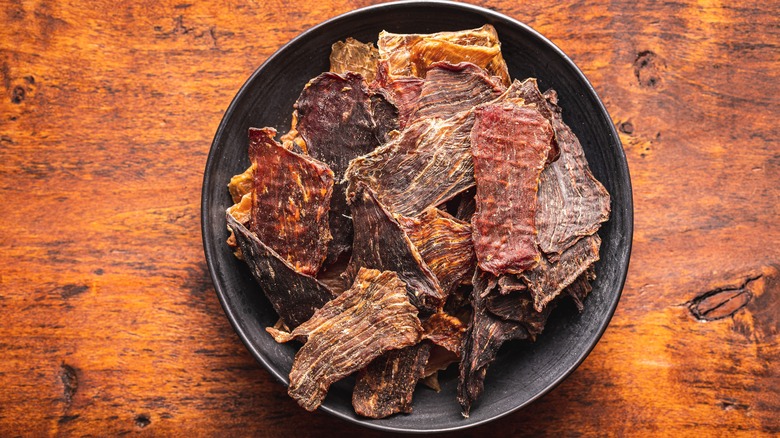 Beef jerky in a black bowl