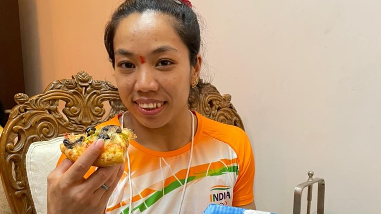 Olympic Weight-Lifter Mirabai Chanu with pizza