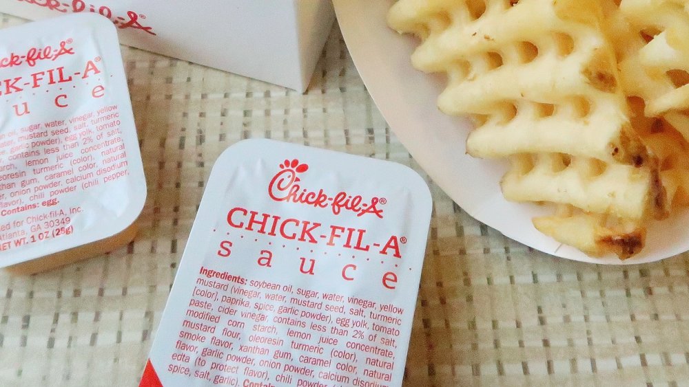 Packets of Chick-fil-A's signature sauce with waffle fries