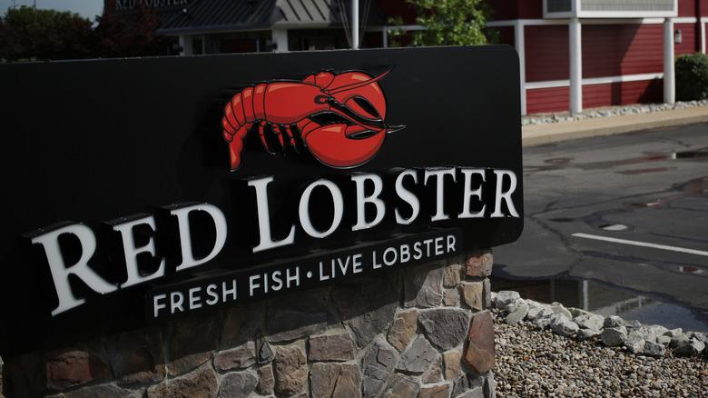 A Red Lobster sign affixed to stone wall