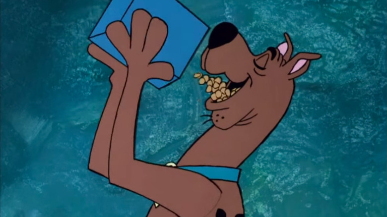 Scooby eating box of Scooby Snacks