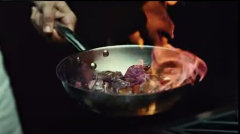 A screenshot from Hannibal of pan over flame