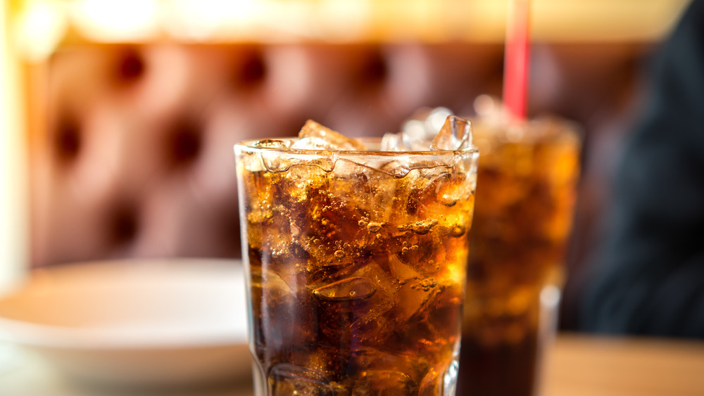 Coca-Cola with ice and straw