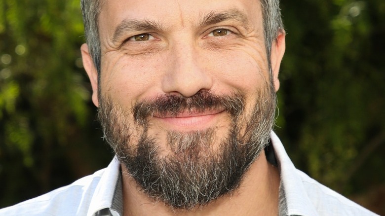 Fabio Viviani smiling wearing blue collared shirt