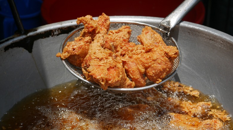 Chicken frying in oil
