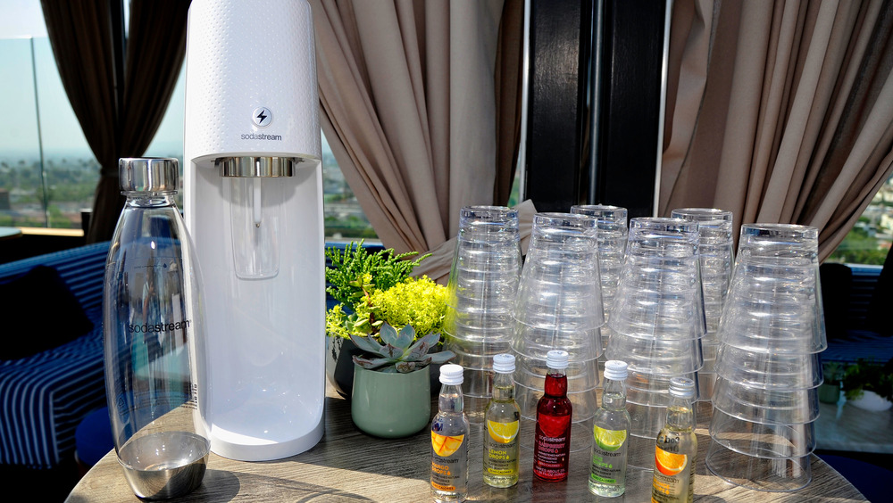 SodaStream with glasses and bottles