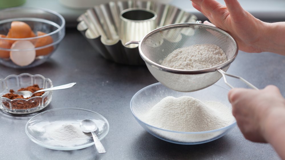 sifting flour for baking a cake