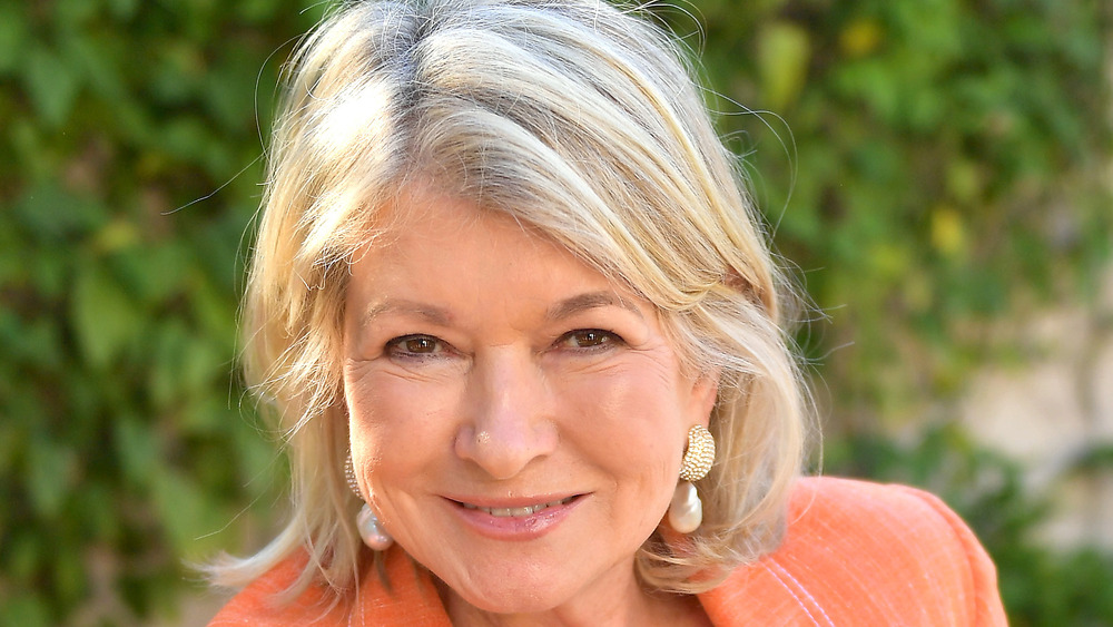 Martha Stewart in orange blazer