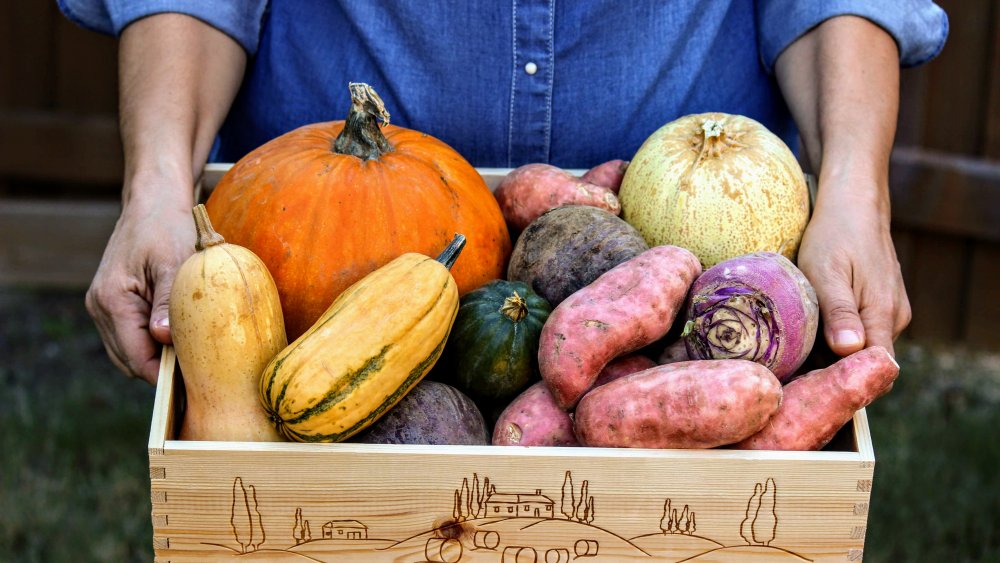 Man holding box of CSA produce