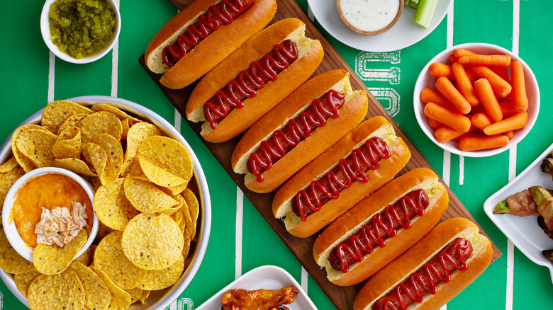 Game day food spread on a green mat